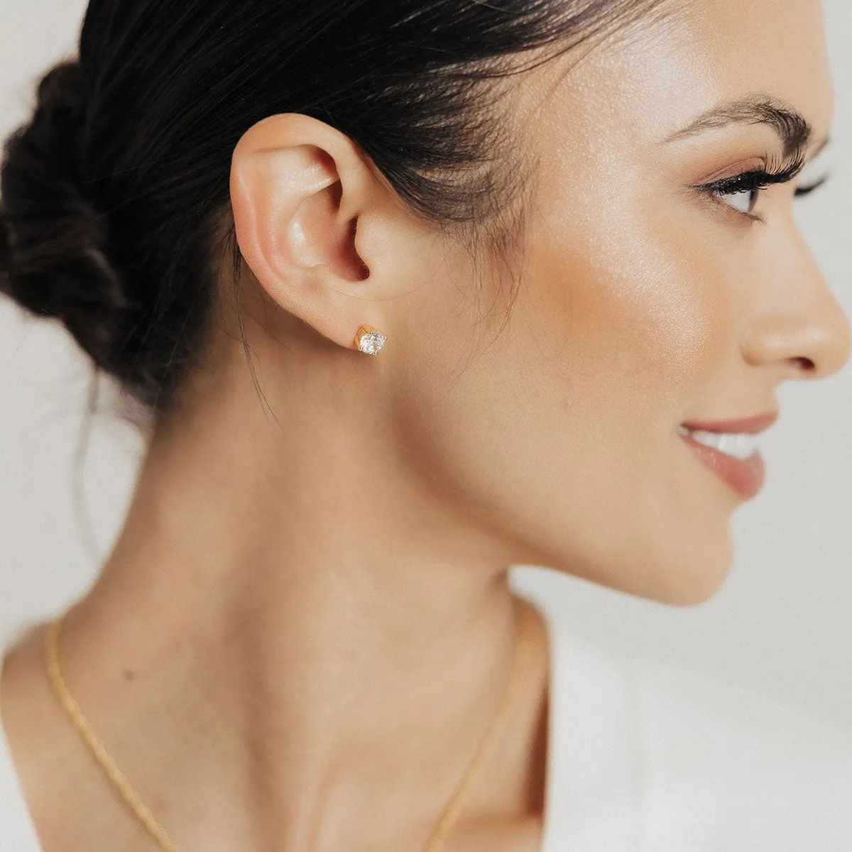 .75 Carat (each) Brilliant CZ Round Stud Earrings in Gold Overlay