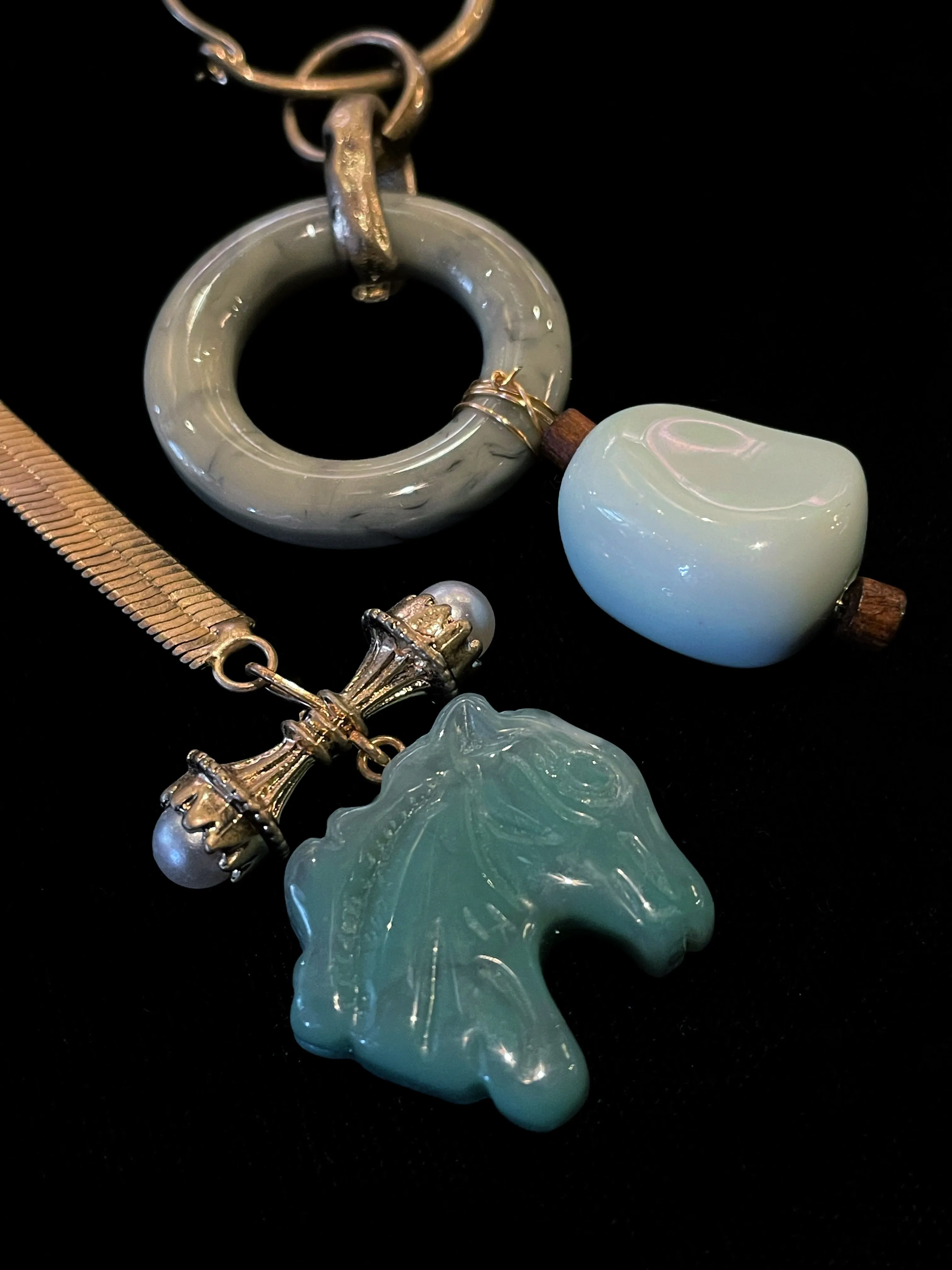 A PAIR OF MISMATCHED SCULPTURAL EARRINGS