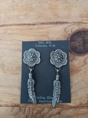 Concho and feather. Native American handcrafted sterling silver earrings, Navajo