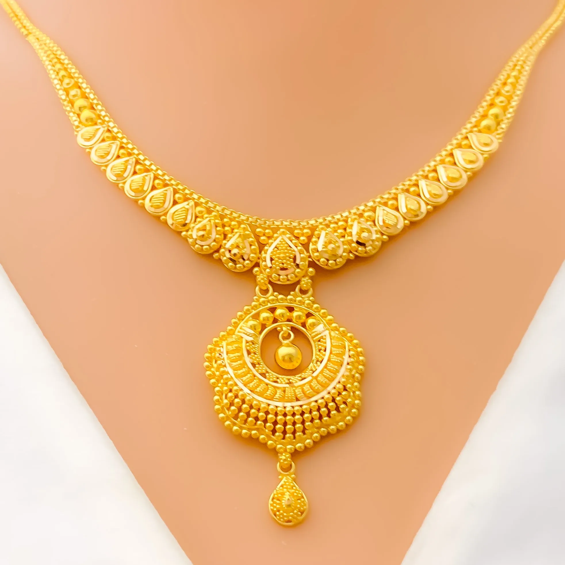 Mesmerizing Peacock Feather Accented 22k Gold Necklace Set